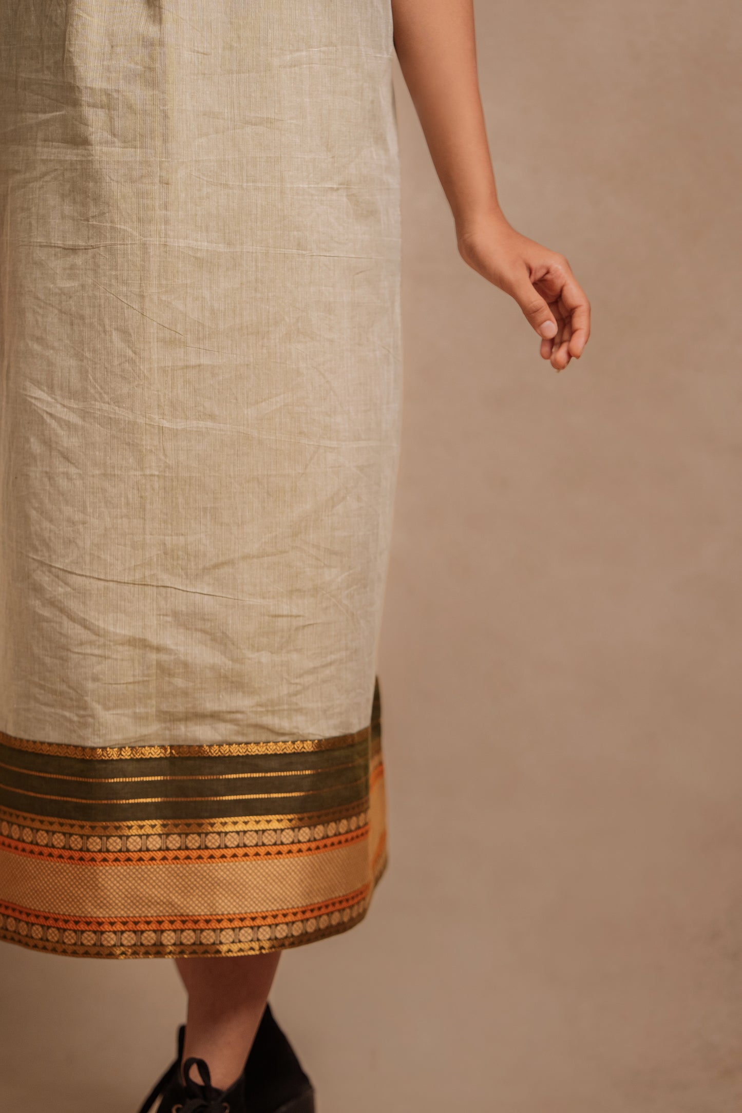 Detailing of a halterneck dress in sage green with a Halterneck by team Akloset.