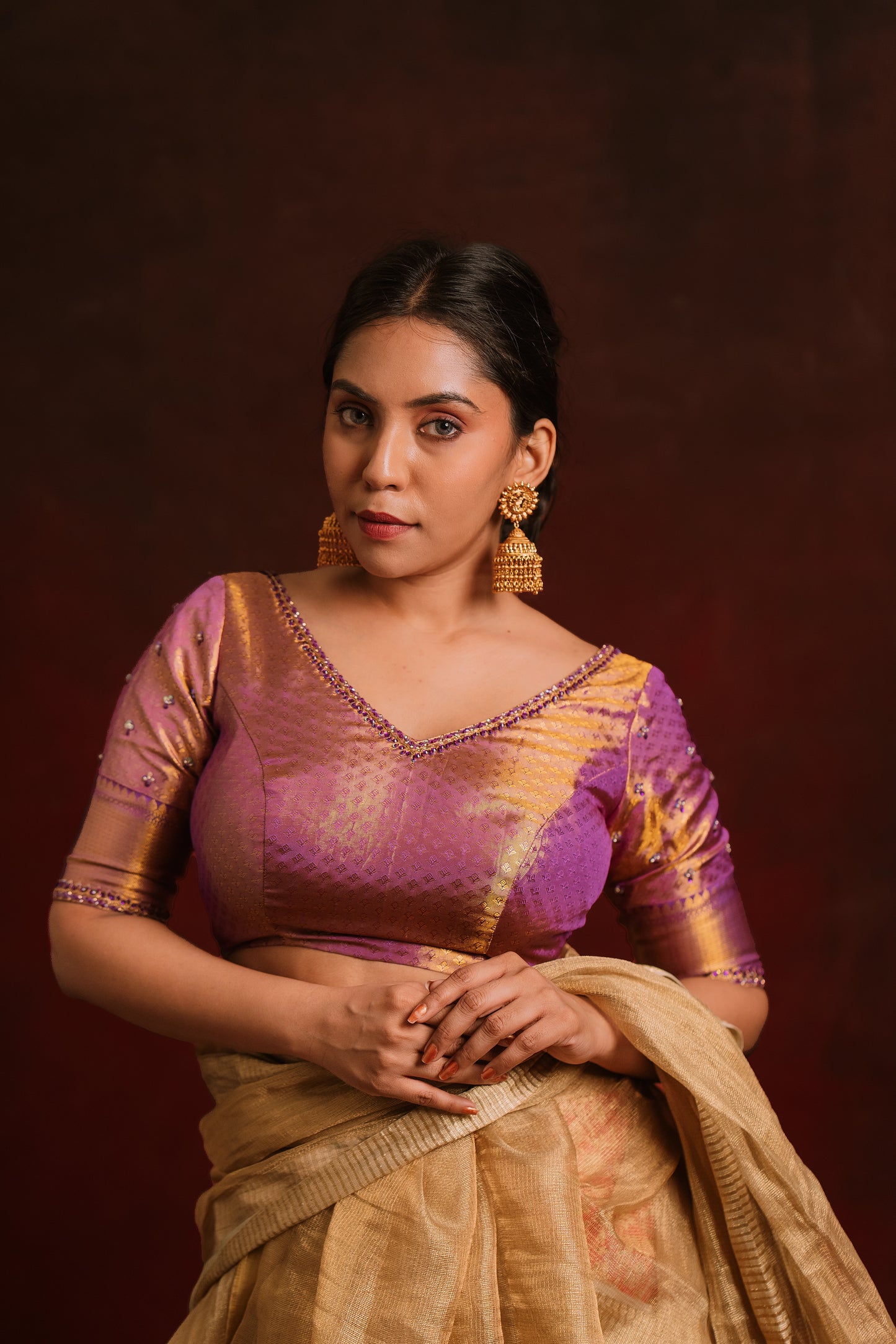 Model Dolly Aishwarya poses in a handcrafted kanjivaram tissue blouse in purple (Dual Tone Silk) by team AKloset. Fashionable, high-quality craftsmanship that is stylish and affordable.