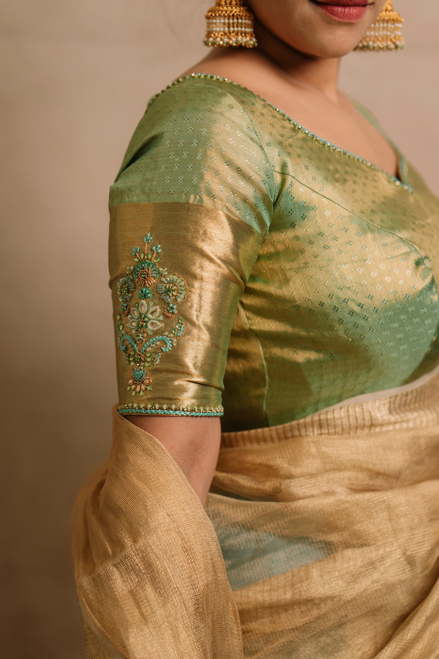 Model Dolly Aishwarya showcases sleeve in a hand embroidered kanjivaram tissue silk blouse in pistachio green (dual tone silk).
Fashionable, high-quality craftsmanship that is stylish and affordable.