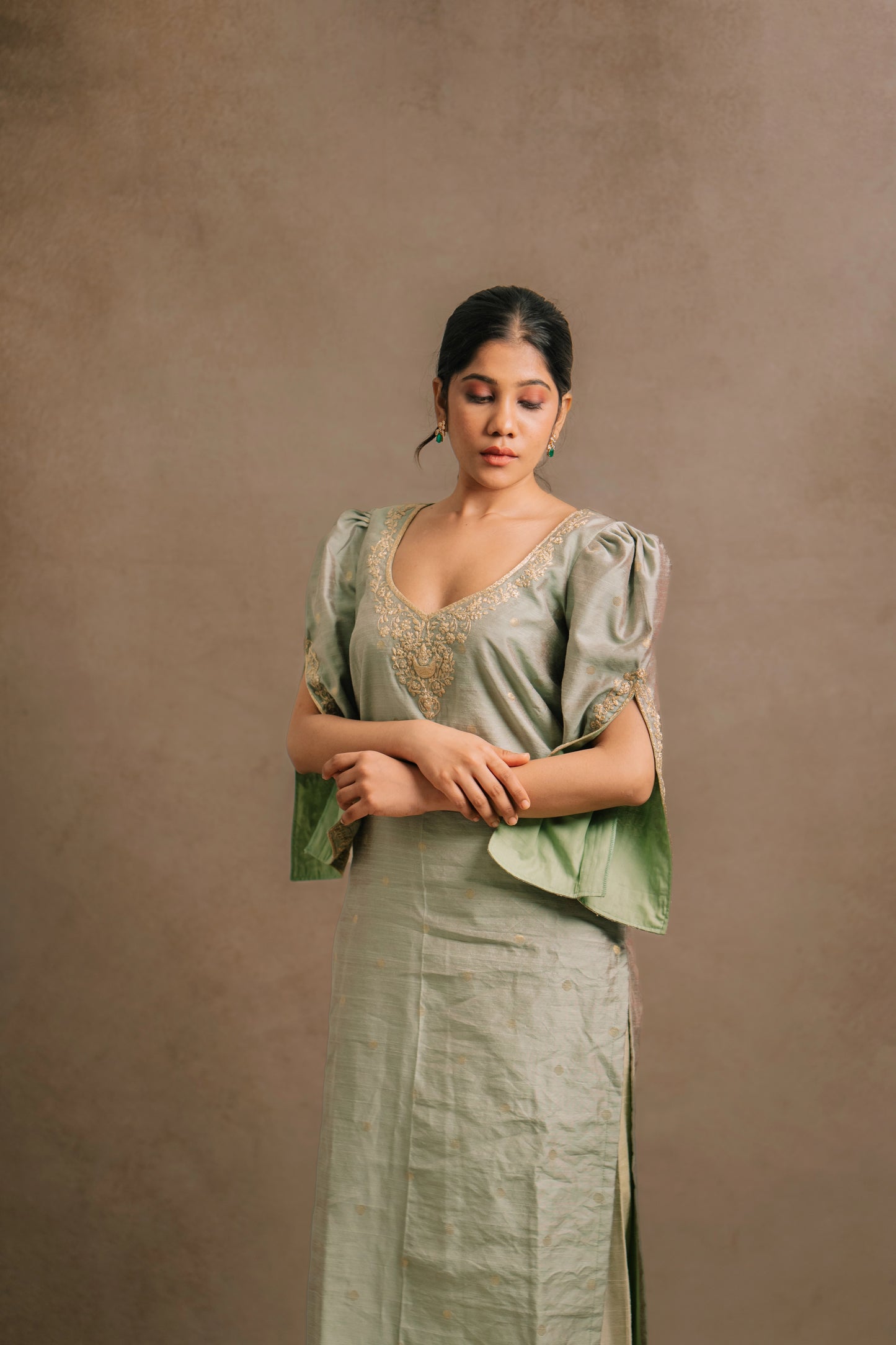 Model Jaina Parmar during photoshoot in an embroidered jute cotton kurti set in muted pistachio green by team AKloset.