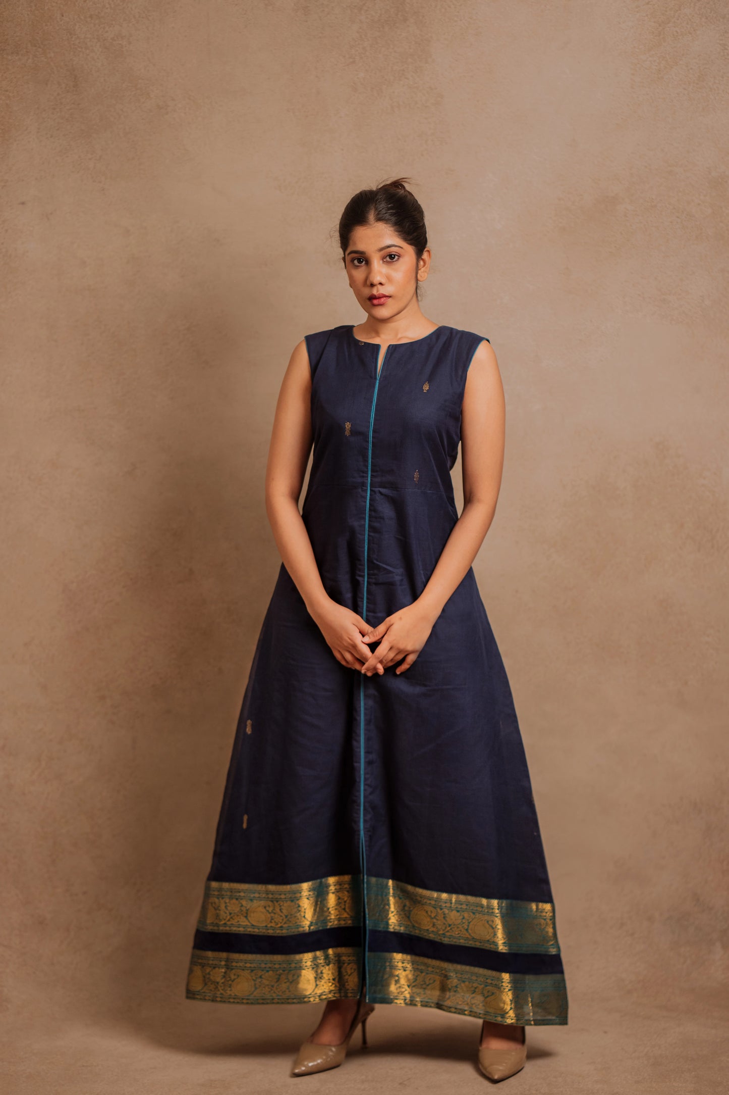 Model Jaina Parmar in a sleeveless a-line dress in blue by team AKloset.