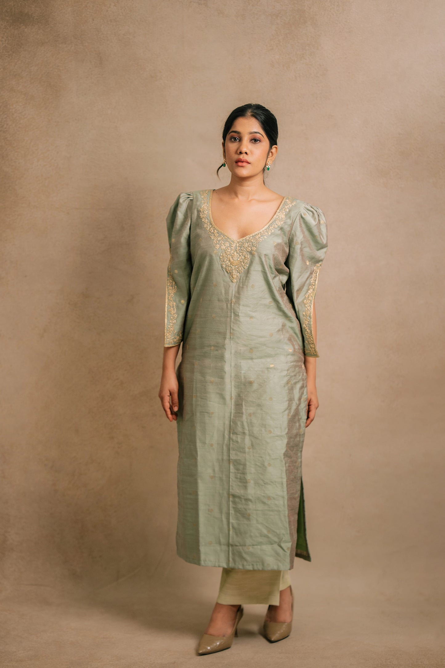 Model Jaina Parmar in an embroidered jute cotton kurti set in muted pistachio green by team AKloset.