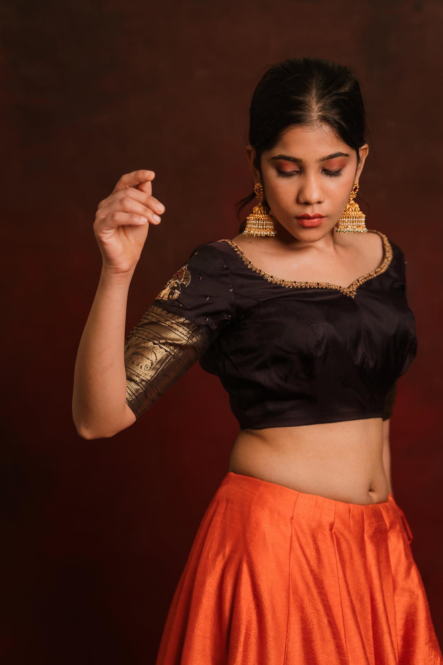 Model Jaina Parmar poses during photoshoot in a hand embroidered kanjivaram silk blouse in brown by team AKloset. Fashionable, high-quality craftsmanship that is stylish and affordable.