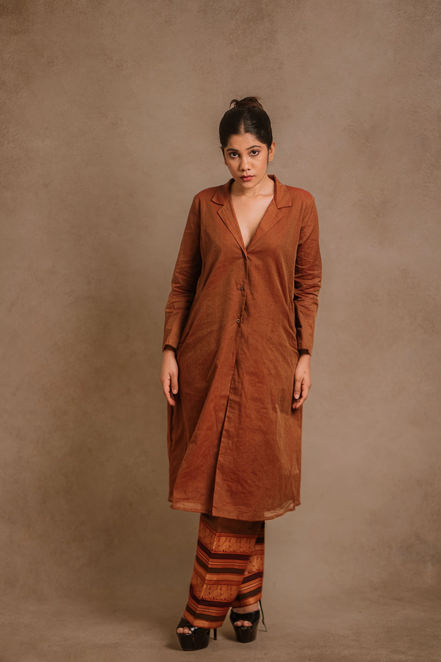 Model Jaina Parmar posing in a brown co-ord set by team AKloset.