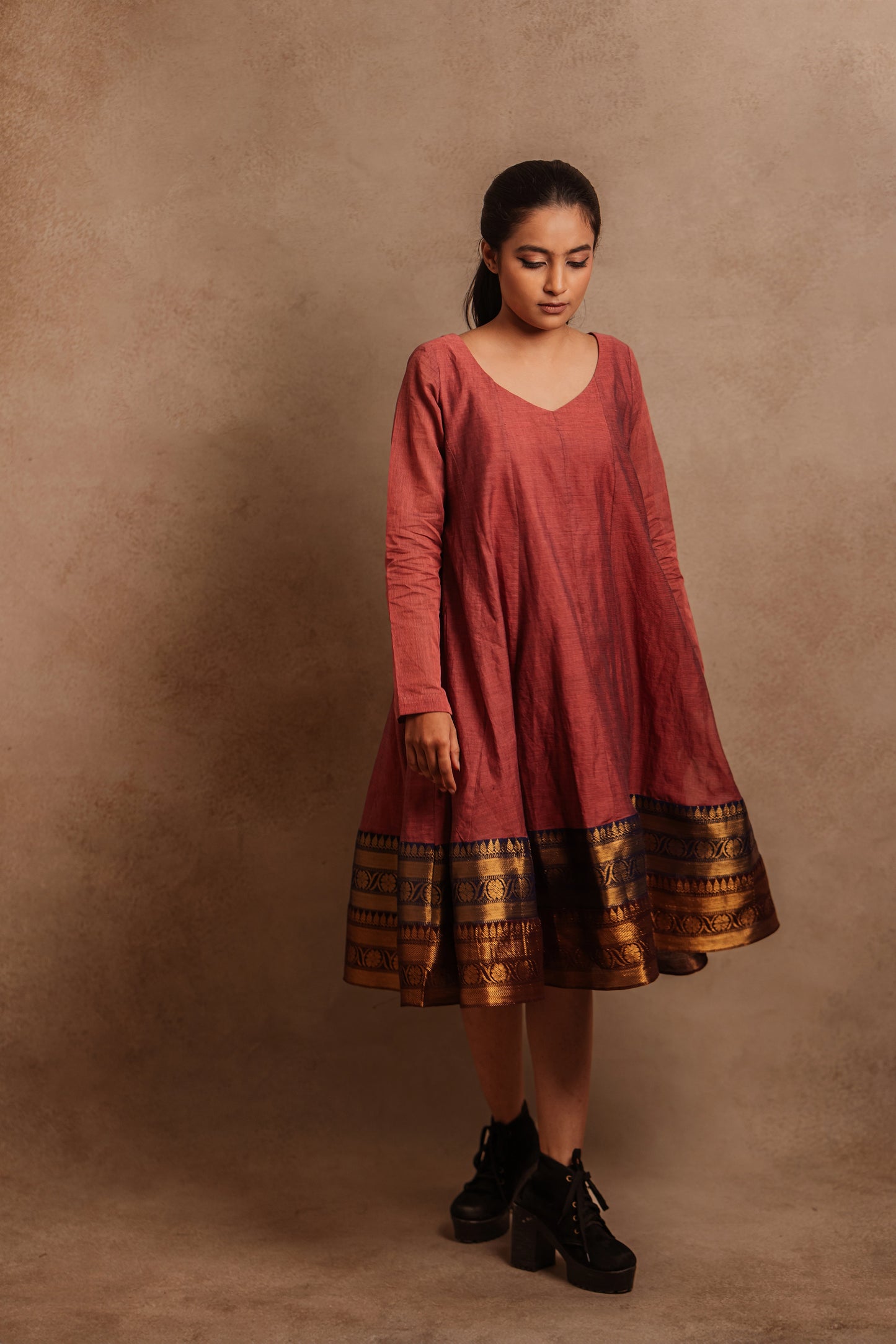 Model Krisha showcasing a kalidar dress in onion pink by team AKloset.