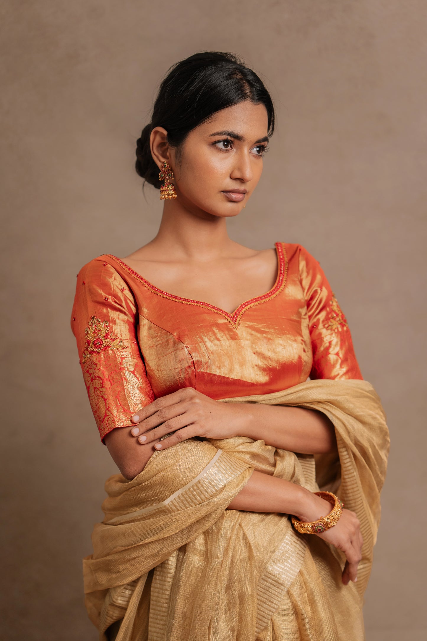 Model Premika Sekar in a hand embroidered kanjivaram tissue silk blouse in red (Dual Tone Silk) by team Akloset. Fashionable, high-quality craftsmanship that is stylish and affordable.
