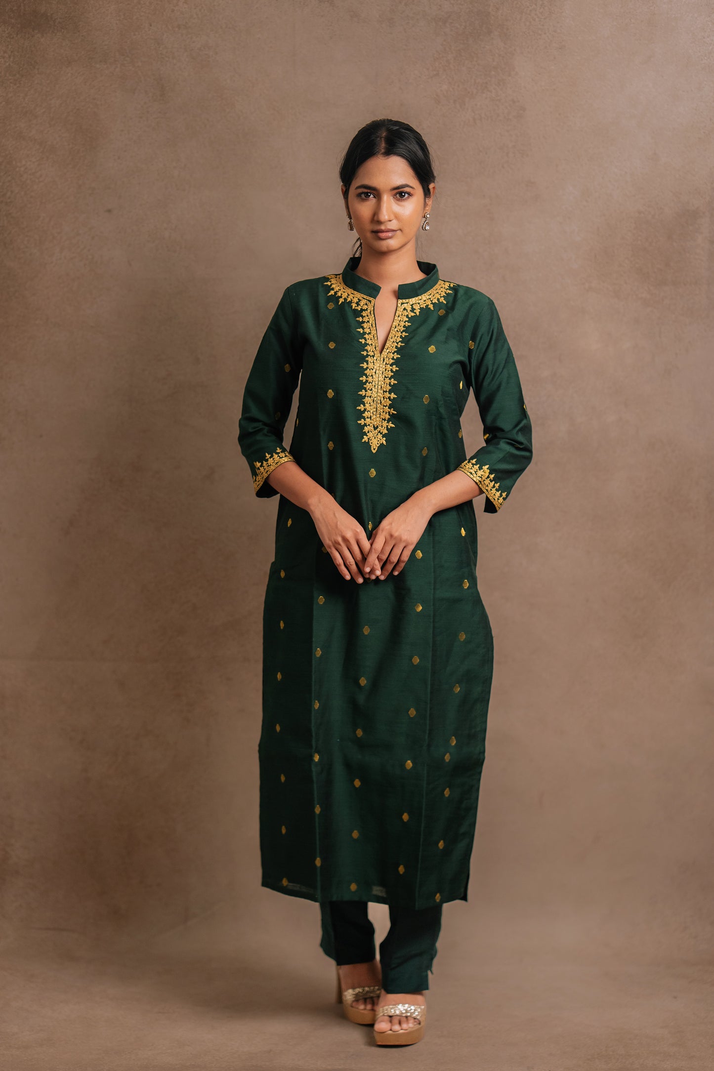 Model Premika Sekar in an embroidered jute cotton kurti in bottle green by team AKloset.