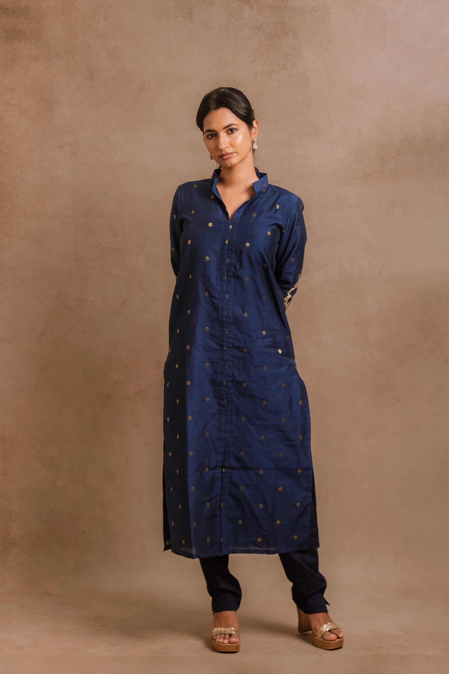 Model Premika Sekar posing in an embroidered jute cotton kurti set in navy blue by team AKloset.