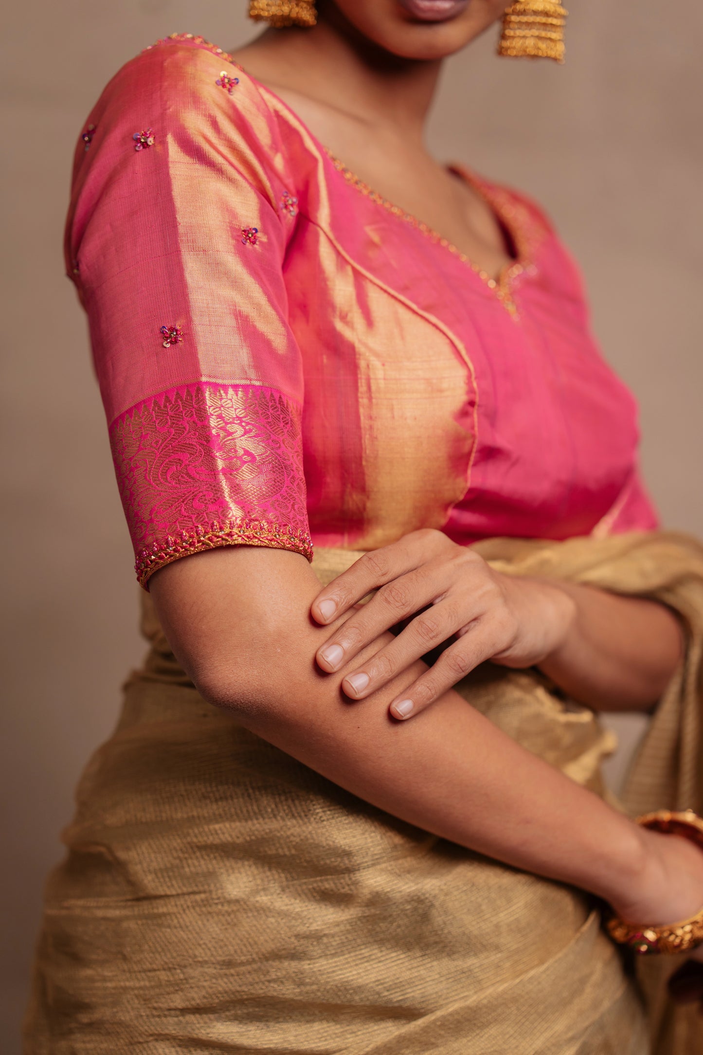 Model Premika Sekar in a hand embroidered Kanjivaram tissue silk blouse in pink (Dual Tone Silk) by team AKloset.