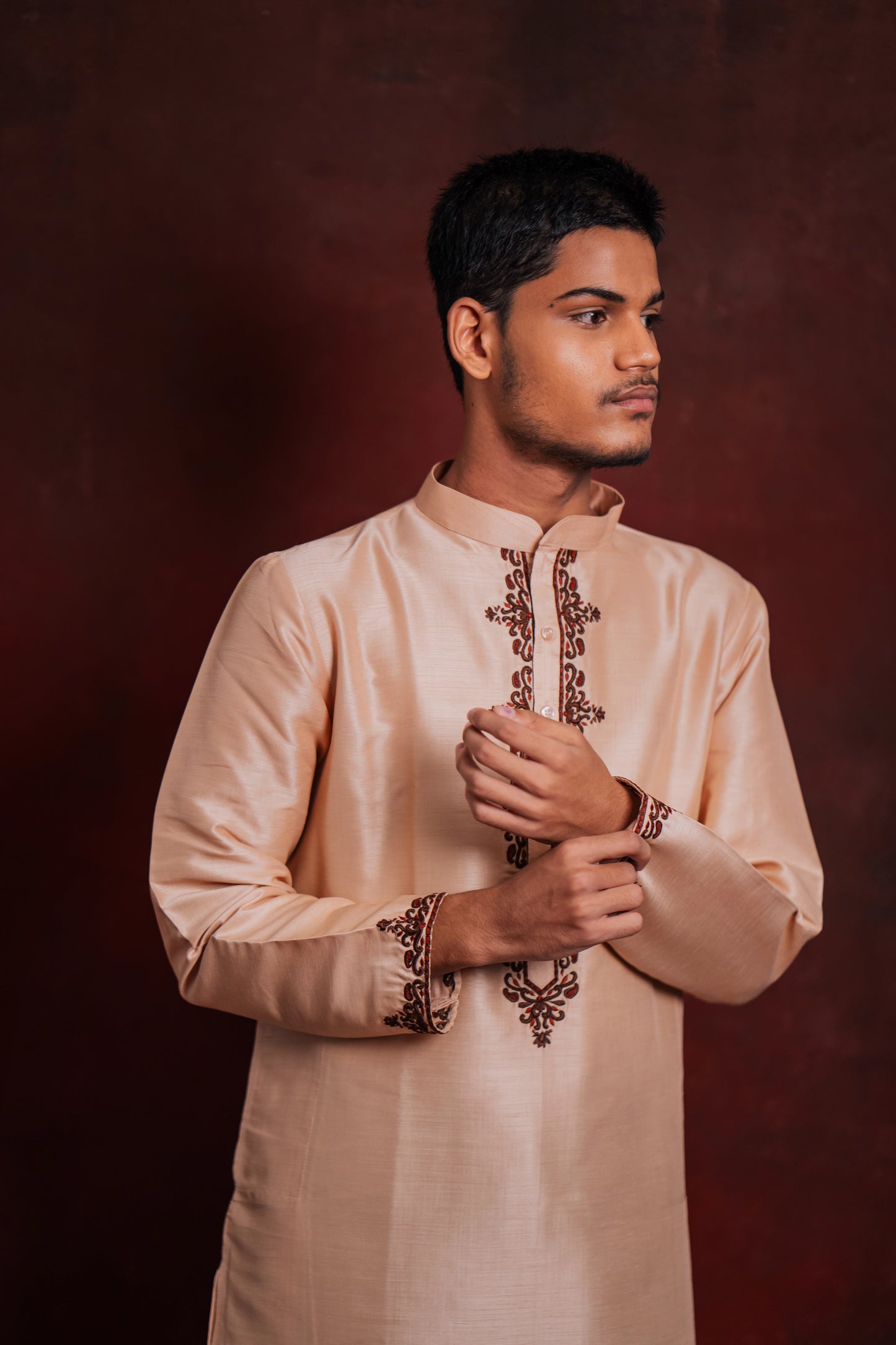 Model poses in a light pink kurta with intricate embroidery by team AKloset.
