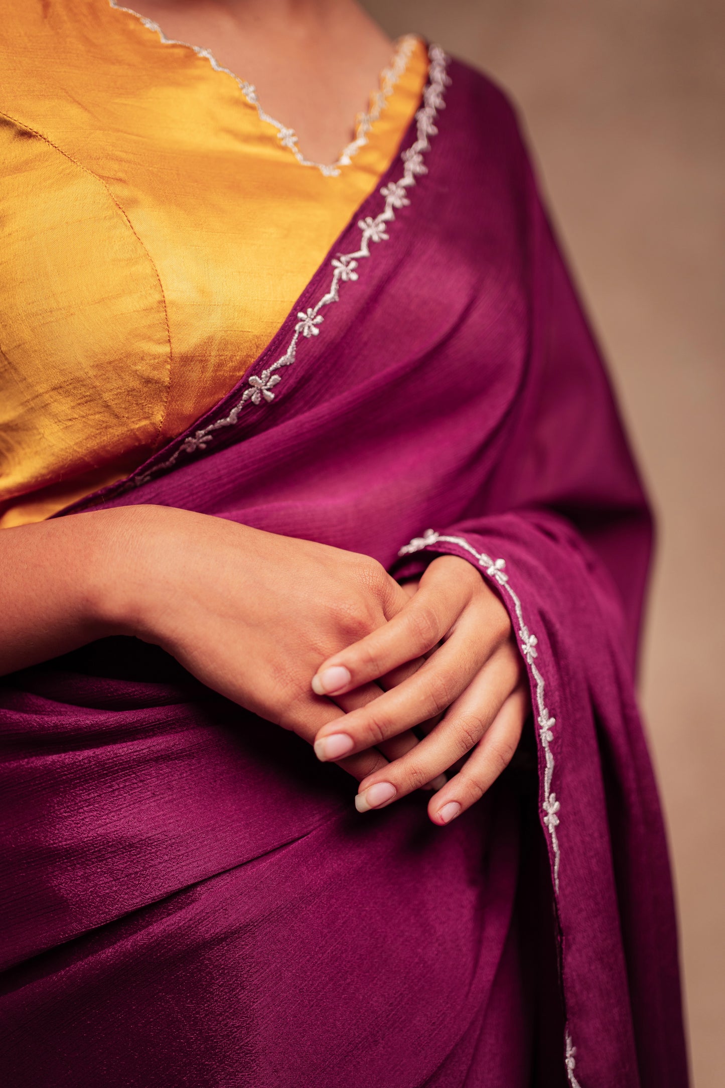 Photoshoot in embroidered shimmer chiffon saree in purple paired with an embroidered mustard yellow chanderi blouse by AKloset.